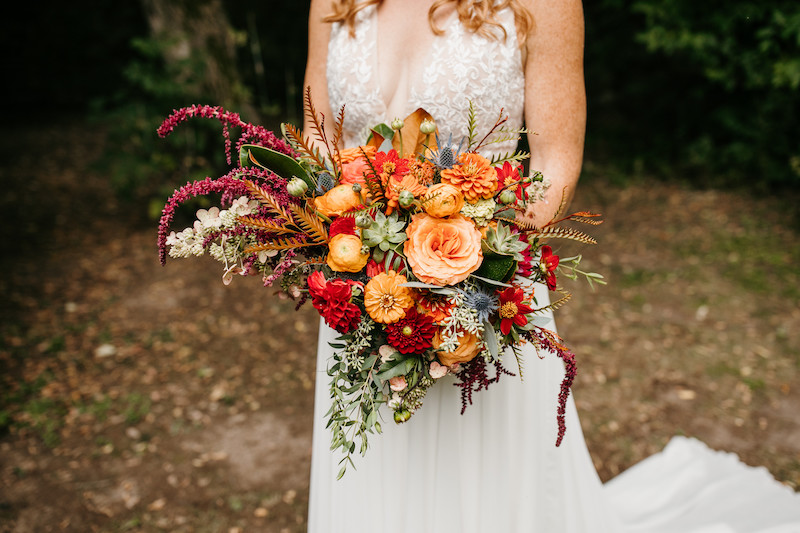 Orange and red fall floral for bride 
