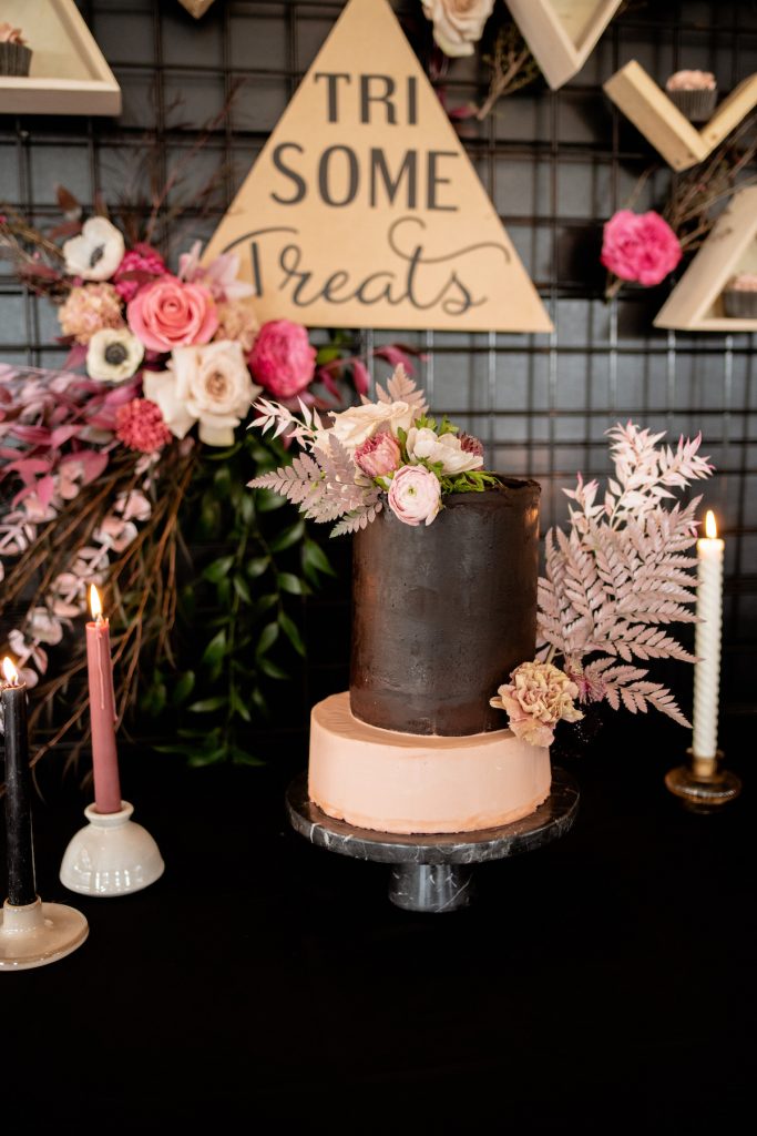 Deep pink single tier wedding cake with boho flowers 