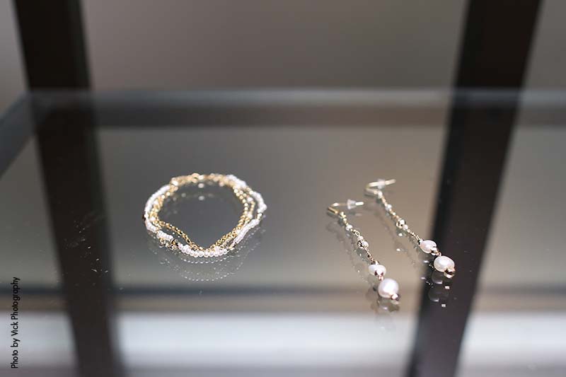 Silver bridal bracelet and dangly pearl earrings