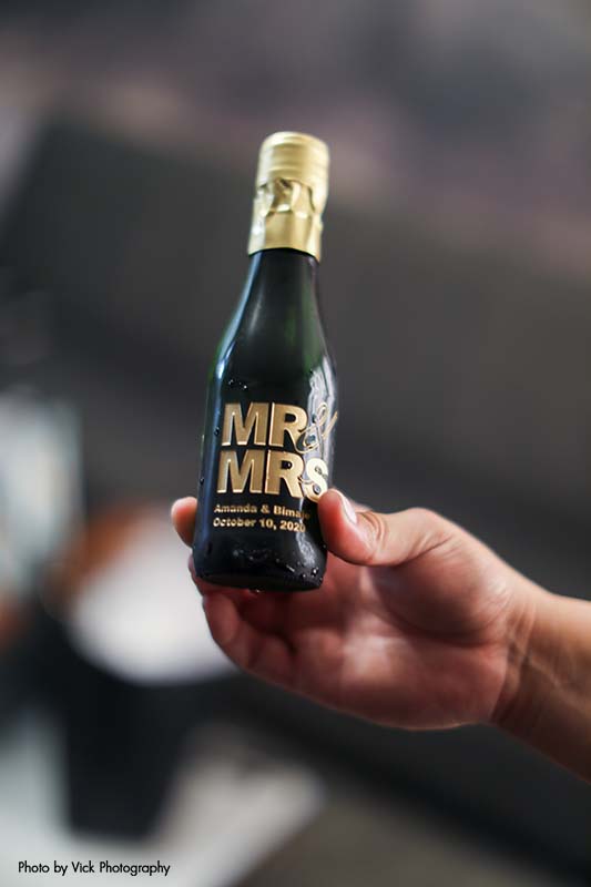 Mini champagne bottle that says "Mr" & "Mrs."