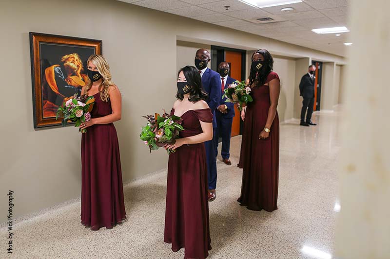 Bridal party in maroon gowns social distancing