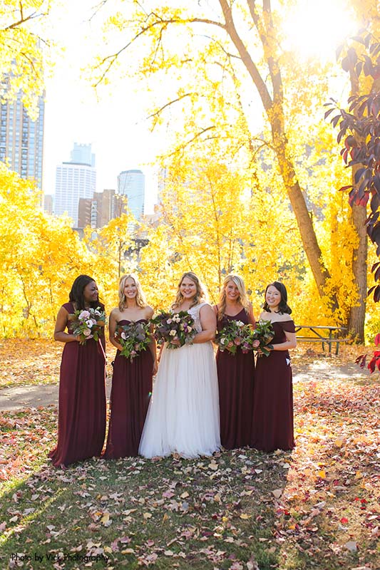 Bridesmaids in maroon dresses