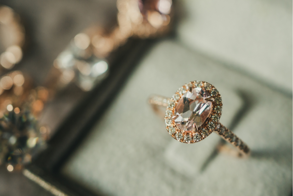 Rose gold engagement ring with oval shaped halo diamond