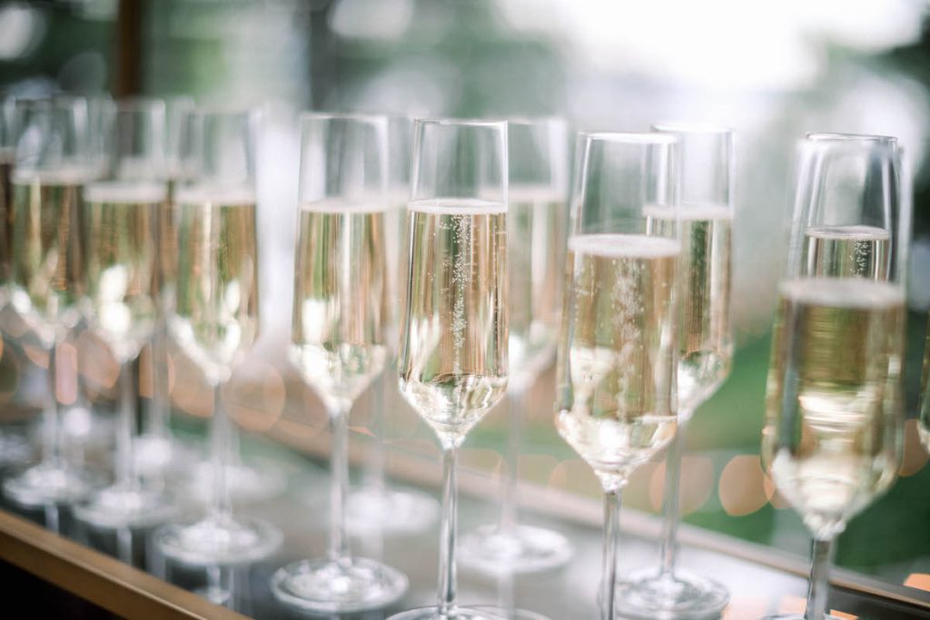 Champagne served in glasses when describing the difference between champagne and sparkling wine