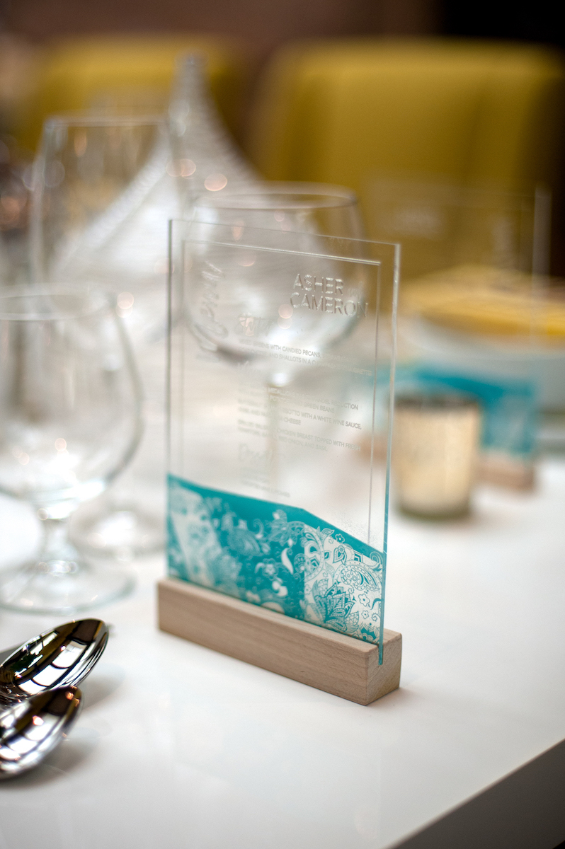 Clear acrylic wedding menu with teal design