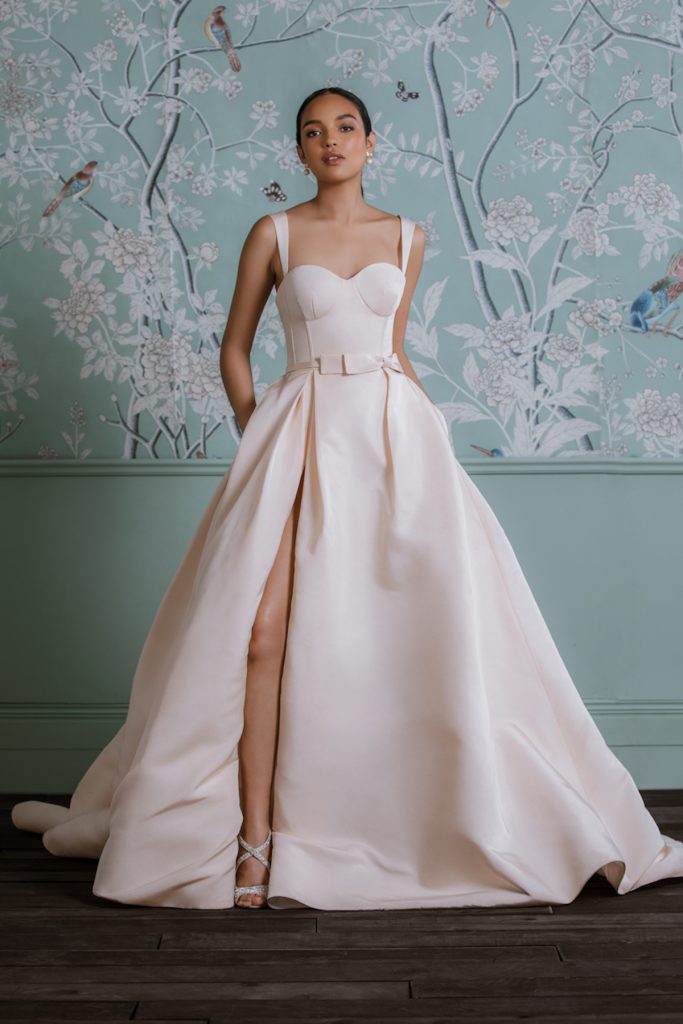 Light pink ballgown wedding dress with high slit and corset top