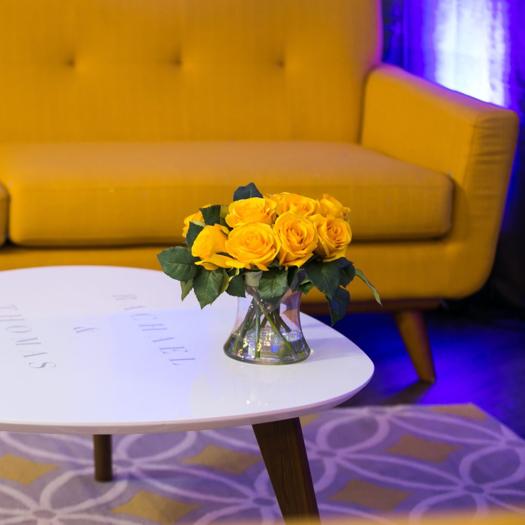 Yellow couch at wedding