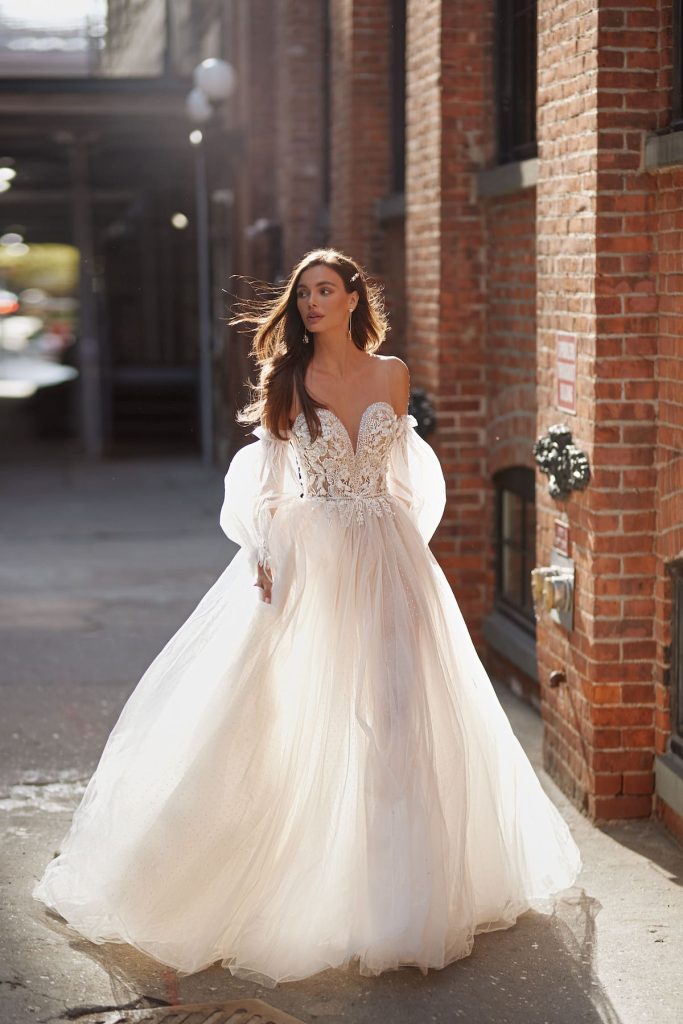 Wedding gown with detachable sleeves and corset bodice 