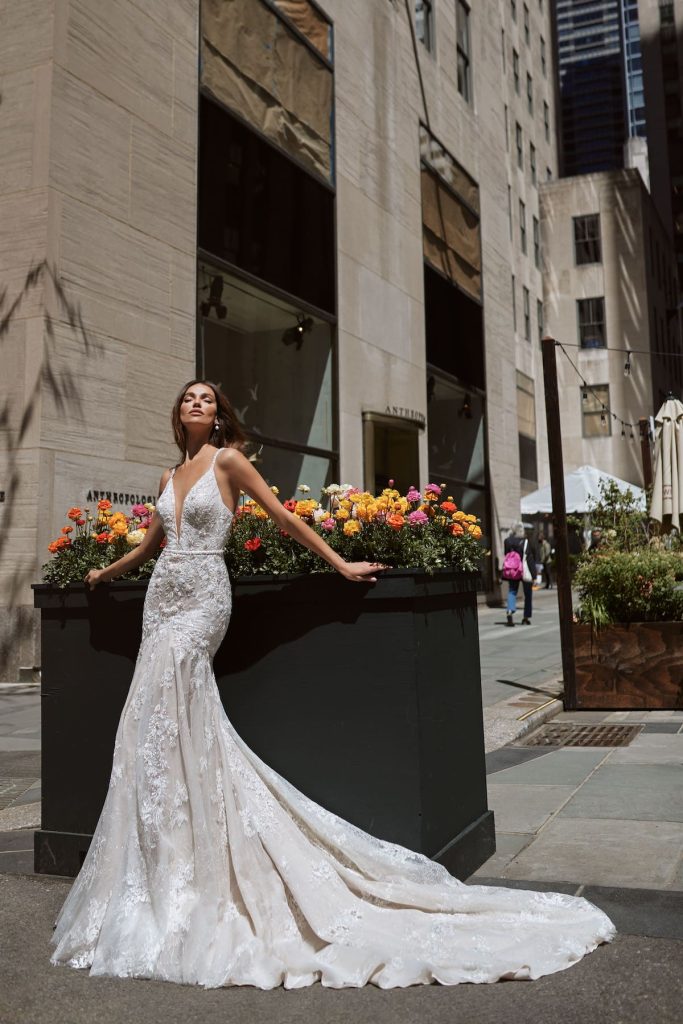 Mermaid bridal gown with embellishments and deep V