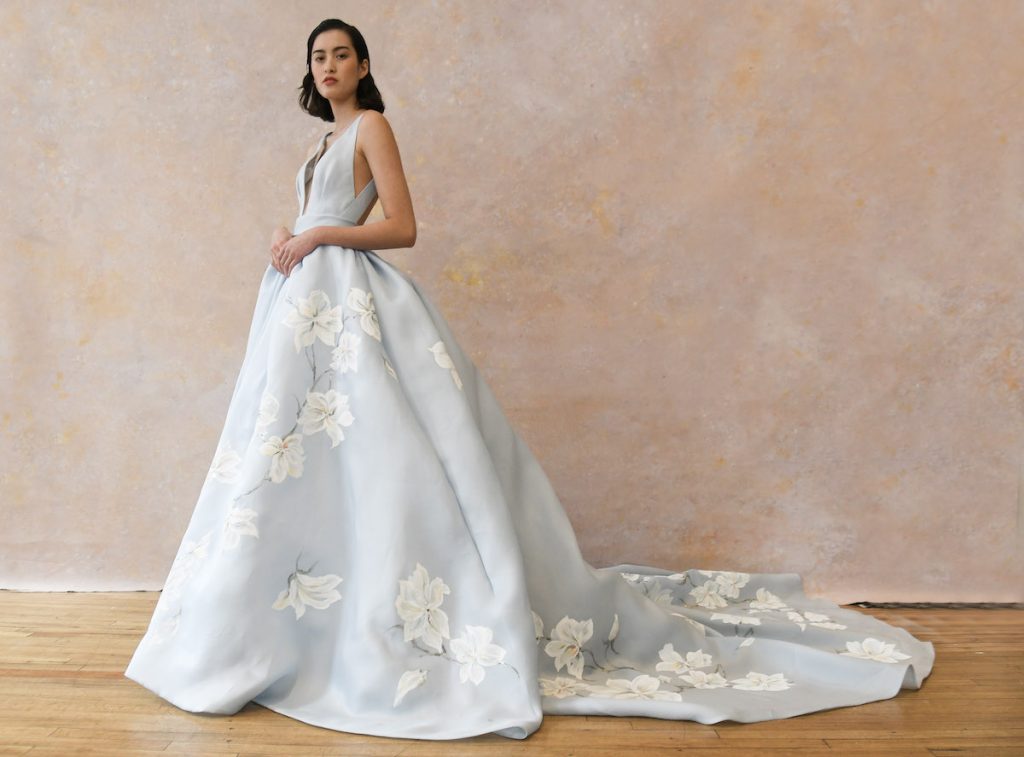 Light blue wedding ballgown with printed white flowers from Spring 2023 Bridal Fashion Weeek