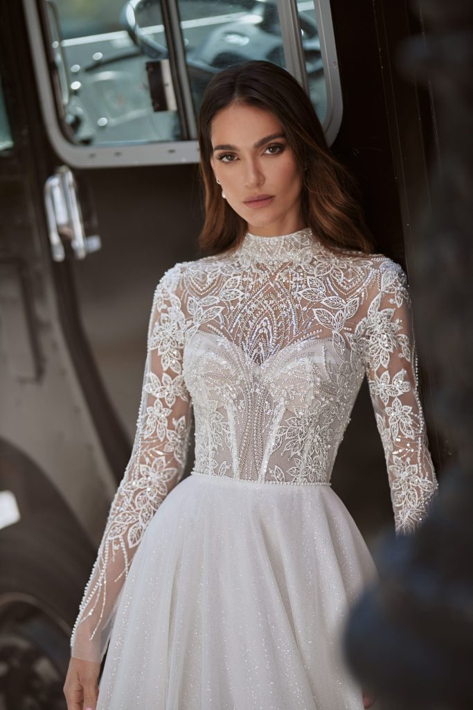 Long-sleeve embellished bridal gown with simple shiny tulle skirt