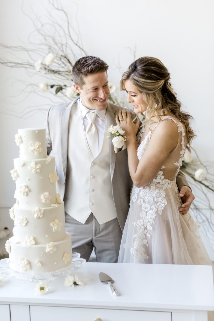 Bride and groom cut 4-tier 3D floral cake
